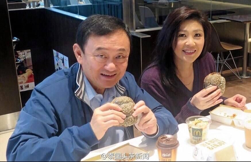 遥控泰国 英拉和他信准备王者归来