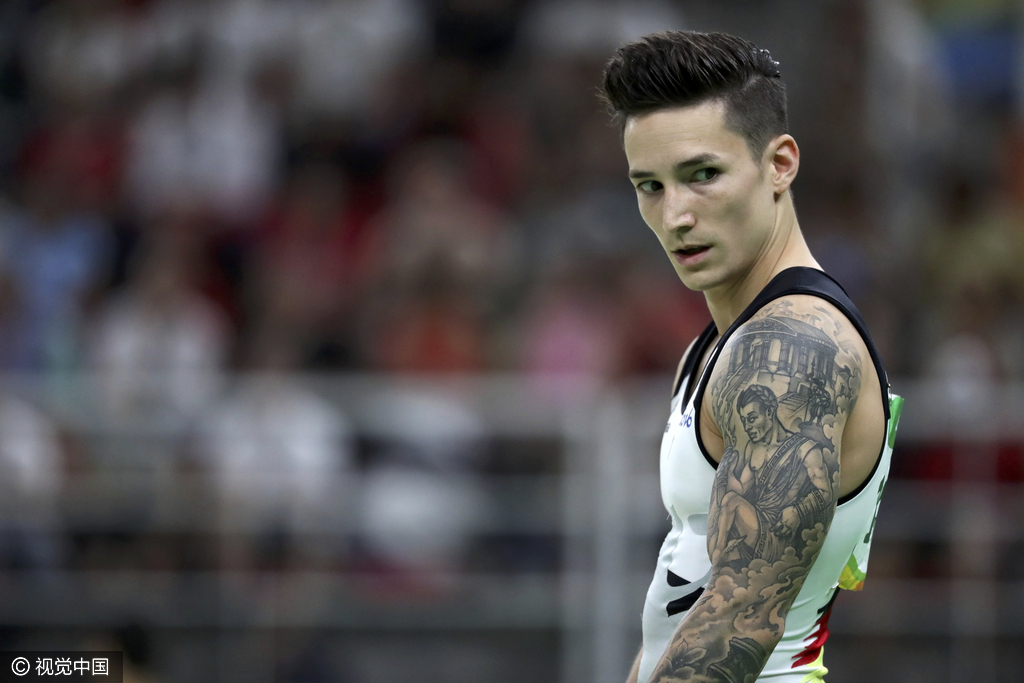 这位体操小哥配上这大花臂痞帅痞帅的！